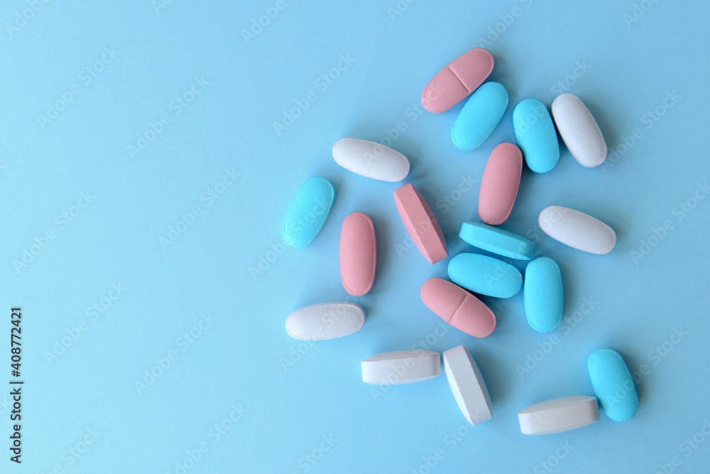 Pharmaceutical medicine pills over blue background