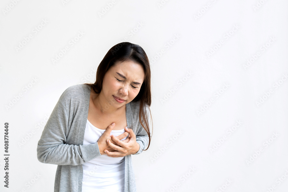 Portrait of tired young woman feeling pain ache touching chest having heart attack. Portrait of tired young woman feeling pain ache touching chest having heart attack.