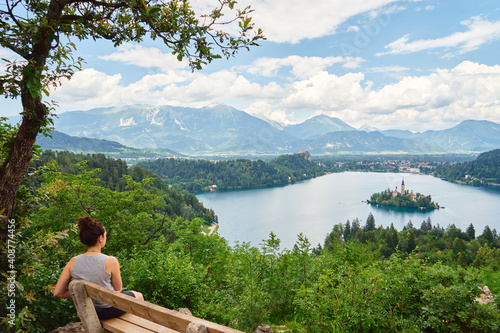 Young girl enjoys the breathtaking view at Lake Bled, Slovenia.