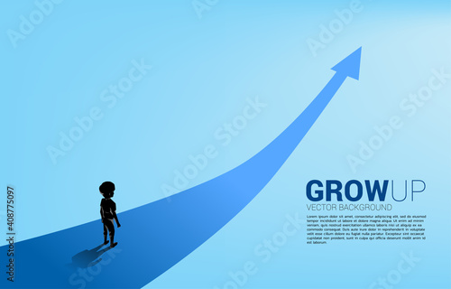 Silhouette of boy standing on route with growth arrow. Concept of education solution and future of children.