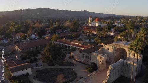 Sunset aerial view of the Spanish Colonial era mission and surrounding city of downtown San Juan Capistrano, California, USA.  photo