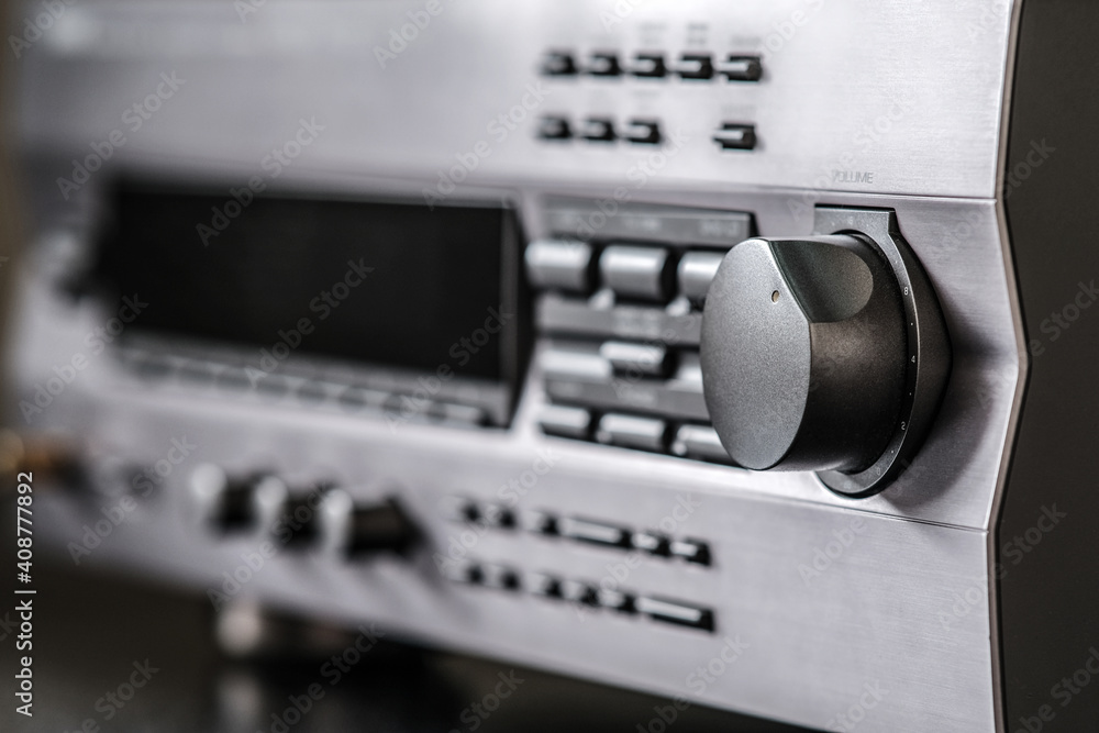 The audio amplifier panel. One large pen is in focus. In the background, you can see the handles with a smaller radius. The audio amplifier panel. One large pen is in focus. In the background, you can see the handles with a smaller radius.
