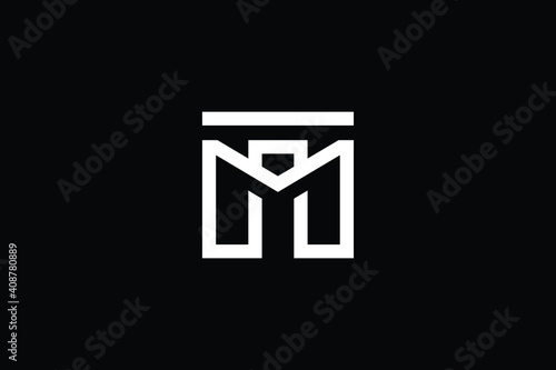 MT logo letter design on luxury background. TM logo monogram initials letter concept. MT icon logo design. TM elegant and Professional letter icon design on black background. M T TM MT