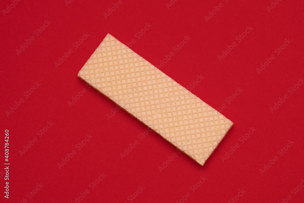 Wafer cookies on a red background top view Wafer cookies on a red background top view