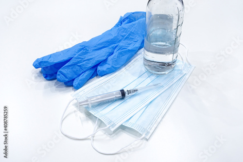 Wallpaper Mural medical mask, syringe, blue medical gloves and a bottle with vaccine. Medical concept vaccination Torontodigital.ca