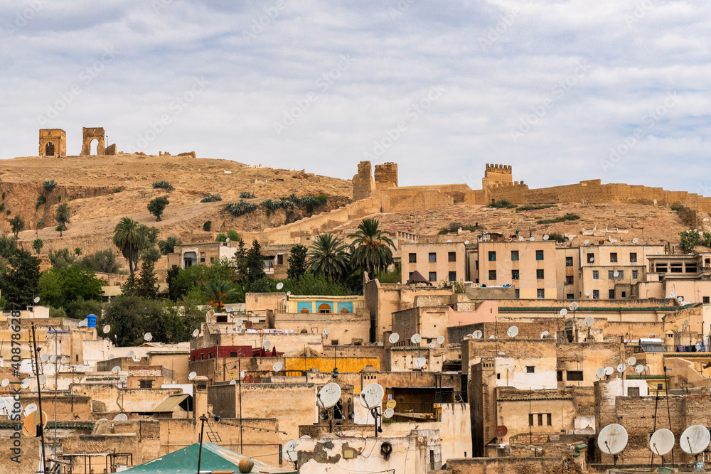 Satellite Dishes all over Fez with a glance of the Marinid Tombs, Morocco.