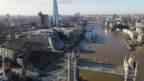 London Tower Bridge amazing Aerial footage, taken in January 2021 showing around the skyline of london business center the River Thames. United Kigdom photo