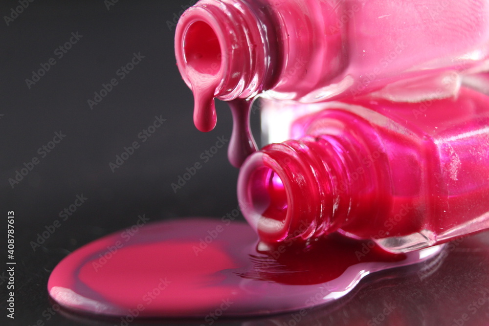 spilled nail polish close-up on a black background with a place for text copyspace spilled nail polish close-up on a black background with a place for text copyspace