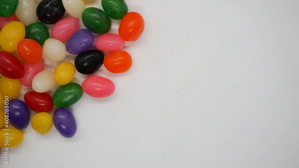 Jelly beans on a white background with copy space for a message. Jelly beans on a white background with copy space for a message.