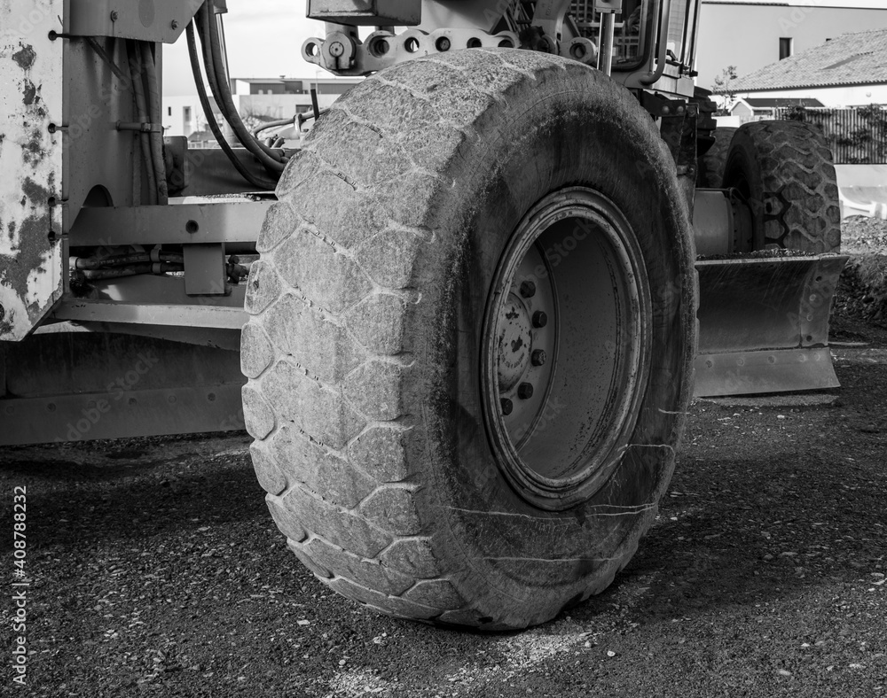 Vendée, France; January 24, 2021: black and white photo of a grader wheel on a road repair site, Saint Gilles Croix de Vie.
Vendée, France; January 24, 2021: black and white photo of a grader wheel on a road repair site, Saint Gilles Croix de Vie.