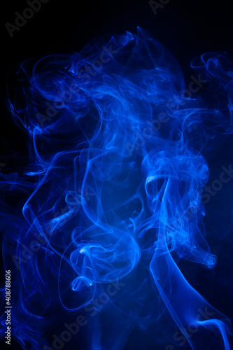 Blue smoke motion on black background.