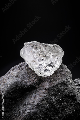 Rough diamond, uncut gemstone, mine bottom. Concept of mining and extraction of rare ores.