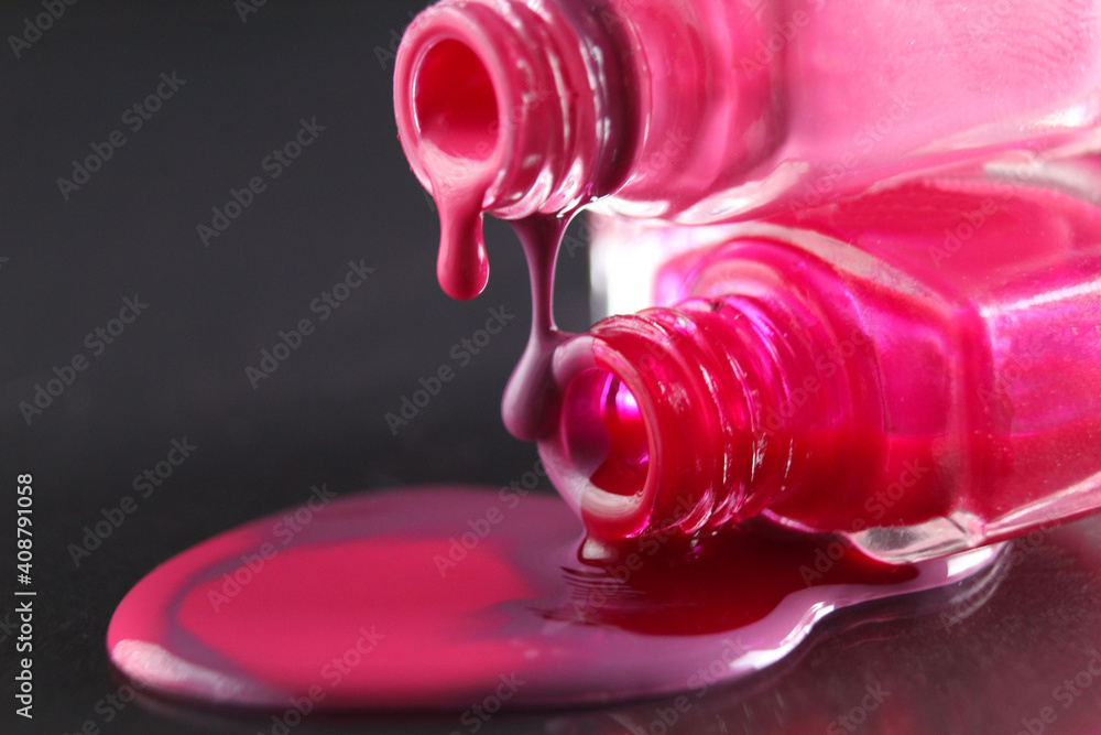 spilled nail polish close-up on a black background with a place for text copyspace spilled nail polish close-up on a black background with a place for text copyspace