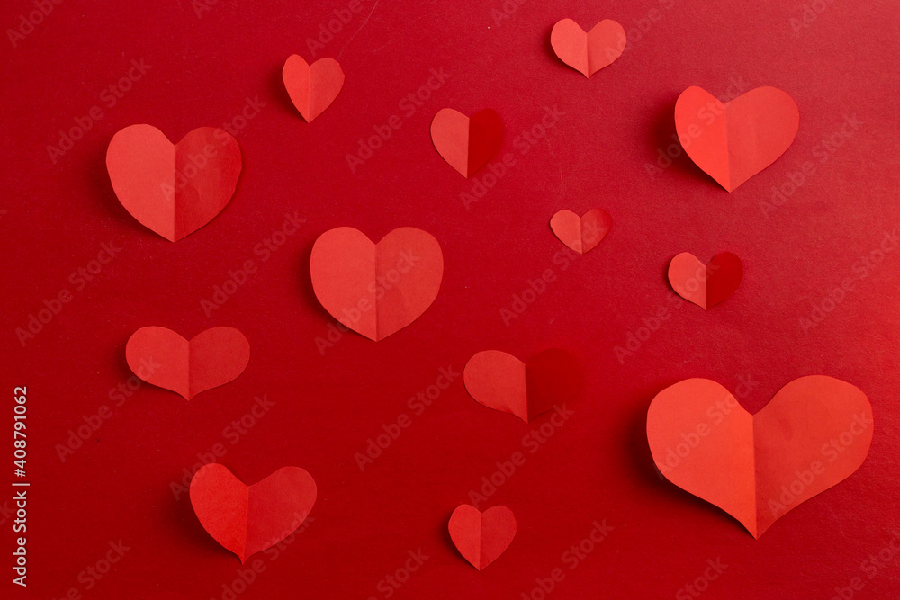 Use scissors to cut into heart-shaped pieces of paper