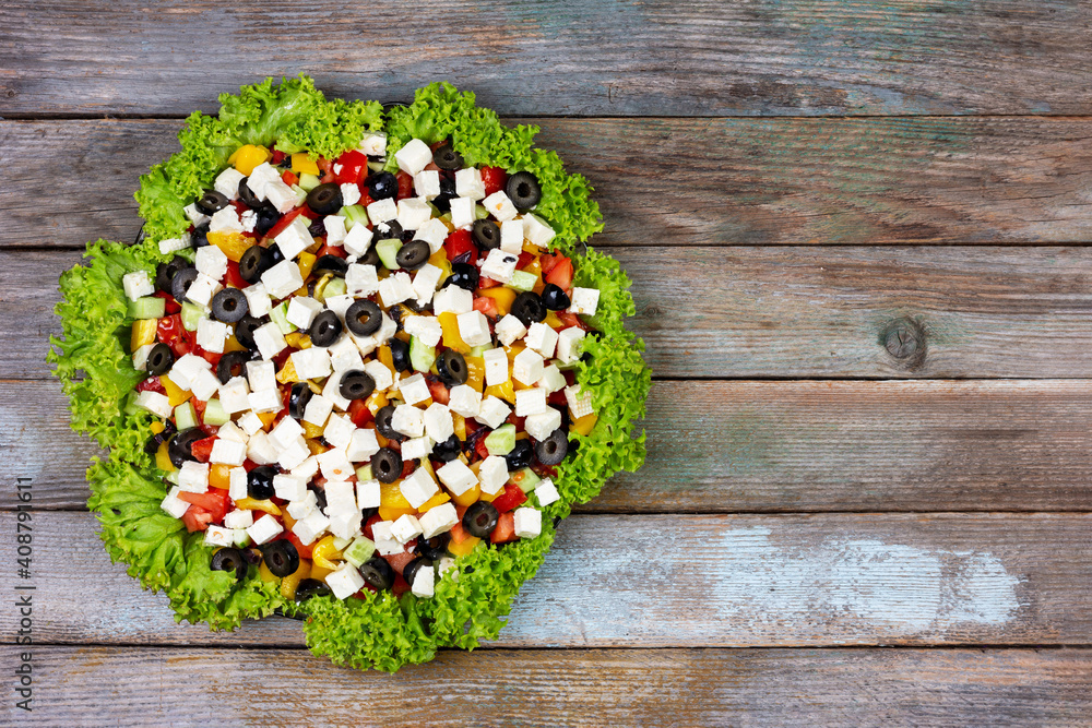 greek salad dish on a wooden background with a copy space, top view greek salad dish on a wooden background with a copy space, top view