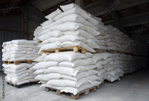 Sacks of flour and grain are stacked in neat rows in the farm's warehouse.Ready-made ingredient for further use.