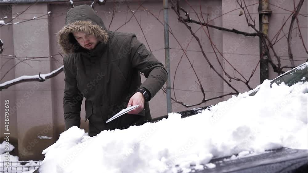 Man take fwom from car and make snowball Man take fwom from car and make snowball