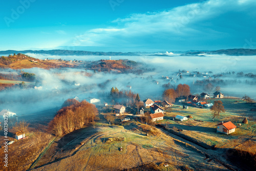 Aerial view of foggy sunrise in Bosnian countryside