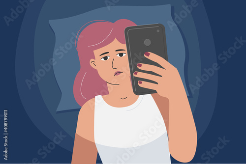 A woman with a phone in bed, addicted to gadgets. Overuse of screen time.