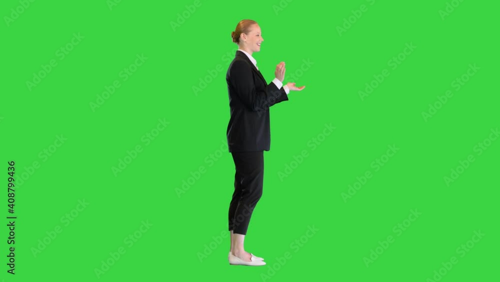 Pretty blonde woman smiling and clapping hands on a Green Screen, Chroma Key. Pretty blonde woman smiling and clapping hands on a Green Screen, Chroma Key.