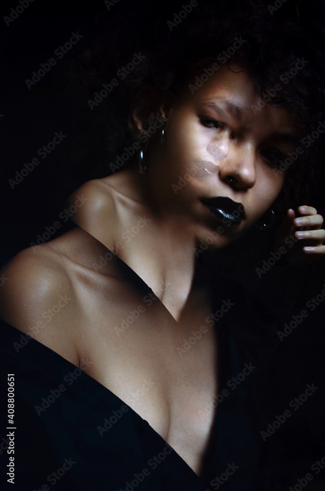 Fototapeta premium African girl photo studio black background double exposure.