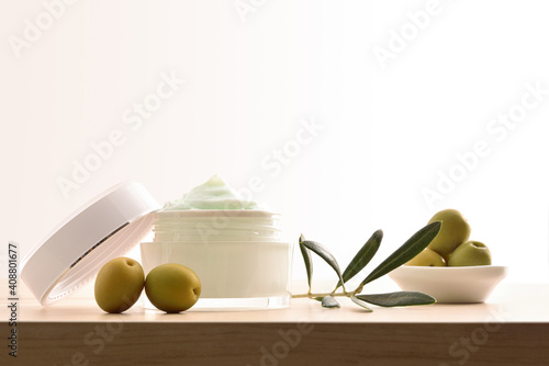 Moisturizing cosmetic cream with olive extract for skin isolated white