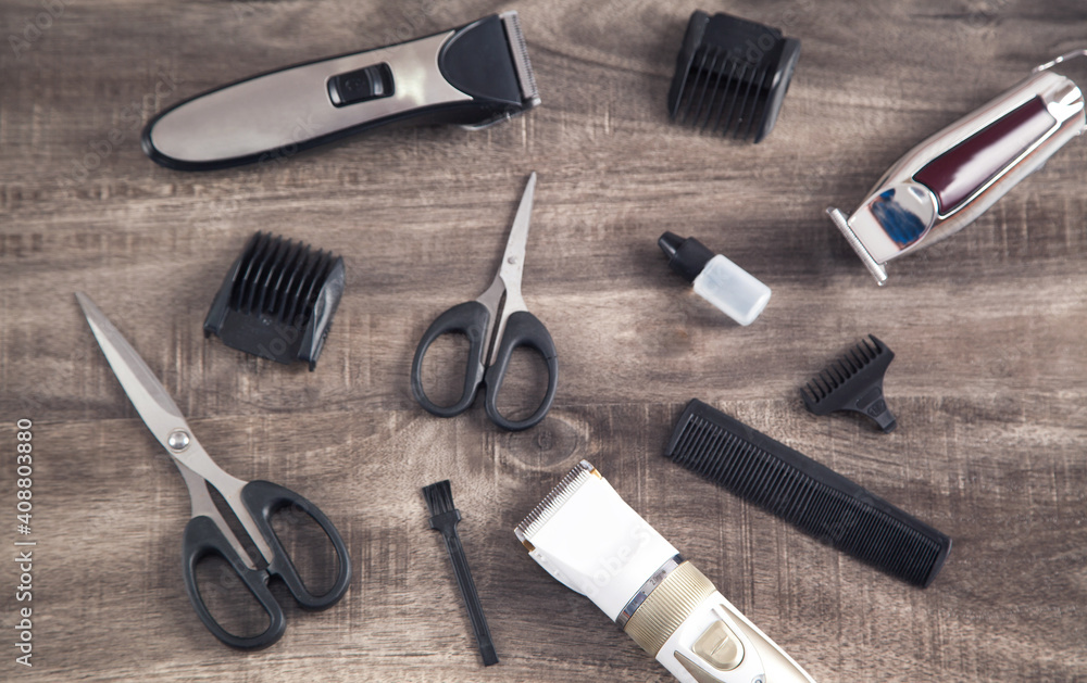 Hair clippers and hair trimmer with comb and scissors.