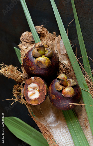 Mangosteen fruits on wooden table photo