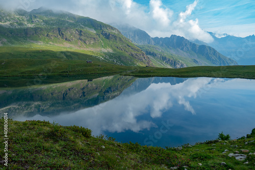 Lago di Malghera in the Italian Alps: Beautiful reflections of mountains and sky