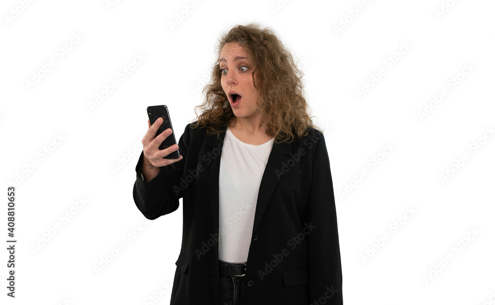 Portrait of a surprised woman holding smartphone in her hand. White background. Portrait of a surprised woman holding smartphone in her hand. White background.