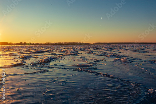 Ice on the river at sunset