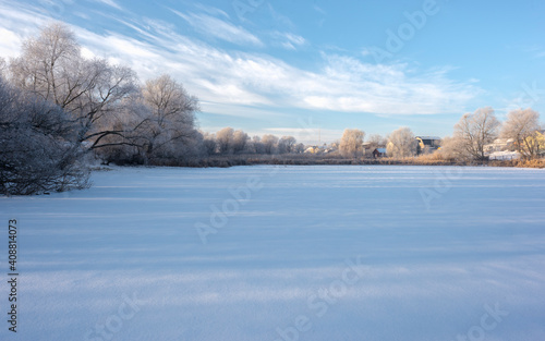 Landscape With Snowy Trees. Frozen Lake. © Kyreichenko