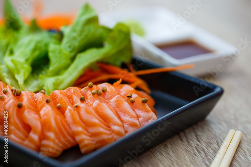 Raw salmon slice or salmon sashimi in Japanese style