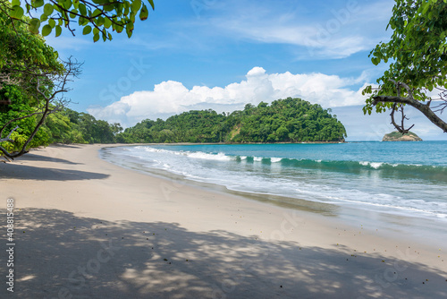 Manuel Antonio beatiful tropical beach with white sand and blue ocean. Paradise. National Park in Costa Rica, Central America. photo