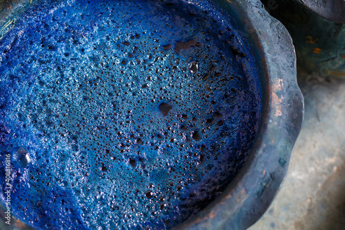  indigo color in clay pot for tie batik dyeing photo