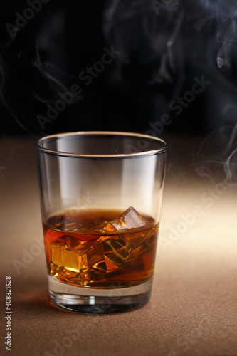 Glass of whiskey and smoke