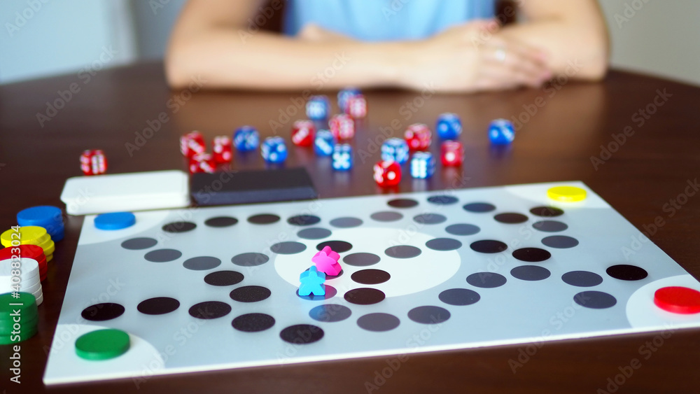 Fototapeta premium woman people playing fun board game on wooden table top selected focus