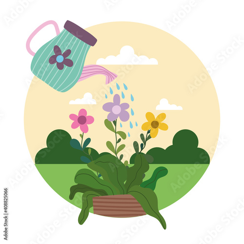 Gardening watering can sprays water to flowers in pot