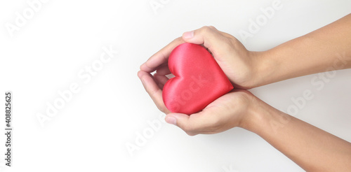 Fototapeta Naklejka Na Ścianę i Meble -  Hands holding  red heart. heart health donation concepts