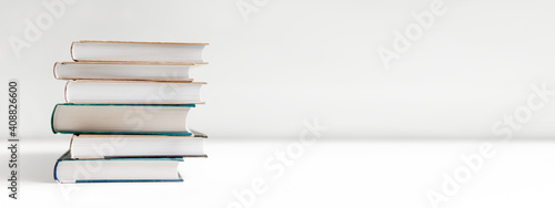 stack of books on white background photo