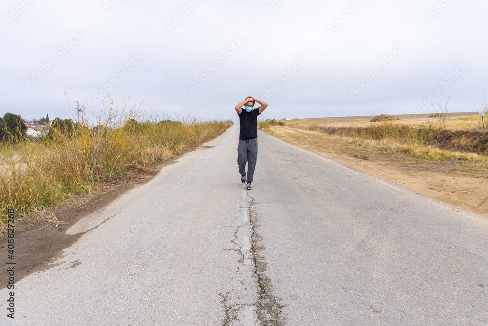 Obraz premium Young Boy Walking in Road