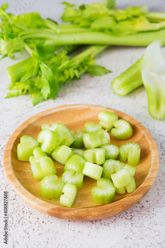 Fresh celery stalks cut into pieces for cooking