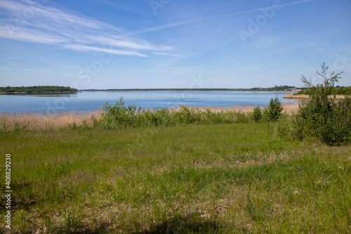 Panorama of renaturized brown coal open pit landscape with the lake Grosser Goitzschesee near the town of Bitterfeld, Germany, Europe