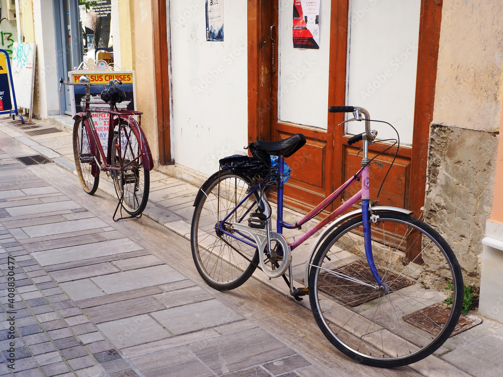 Bicycles in an empty street, in Nafpaktos (Lepanto), Greece