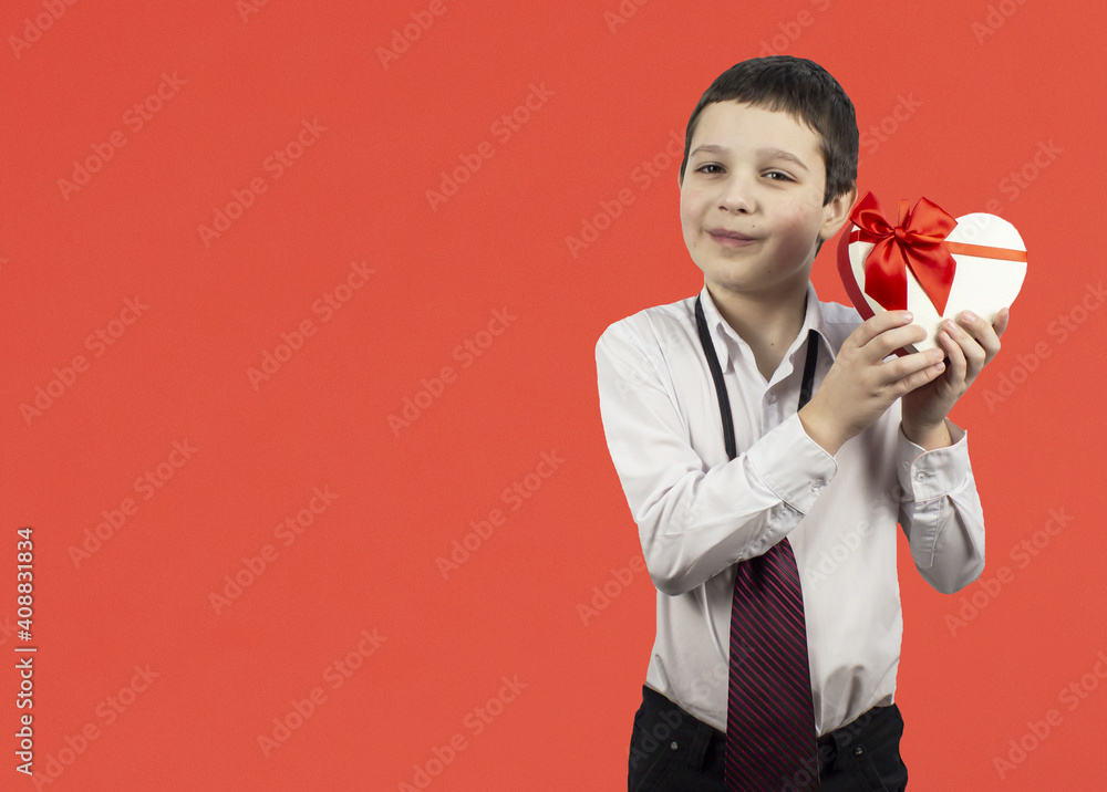 Valentine's day concept Valentine's Day. Valentine's card, valentine's day, banners, postcard. Little boy with a gift in his hands. Copyspace Valentine's day concept Valentine's Day. Valentine's card, valentine's day, banners, postcard. Little boy with a gift in his hands. Copyspace