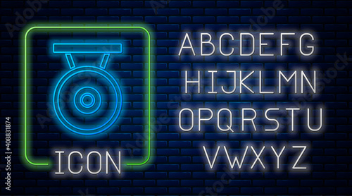 Glowing neon Gong musical percussion instrument circular metal disc icon isolated on brick wall background. Neon light alphabet. Vector.