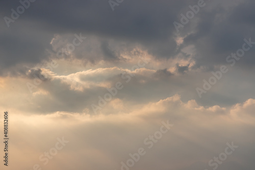 Fototapeta Naklejka Na Ścianę i Meble -  The cloudy beautiful sky with the light shining from the sun. The softness of the cloud creates a feeling of relaxation. copy space. No focus, specifically.