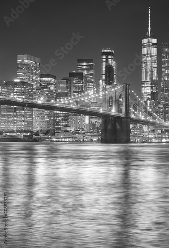 Black and white picture of Brooklyn Bridge at night  New York City  USA.