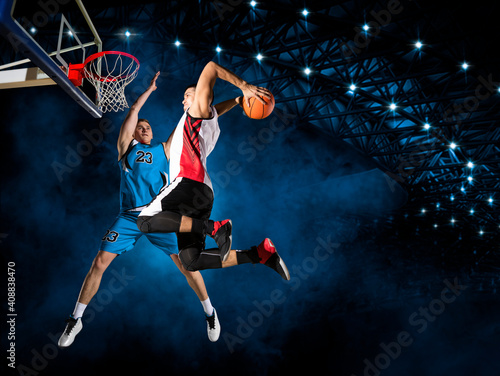 Two basketball players in arena. Blocked shot © Andrey Burmakin