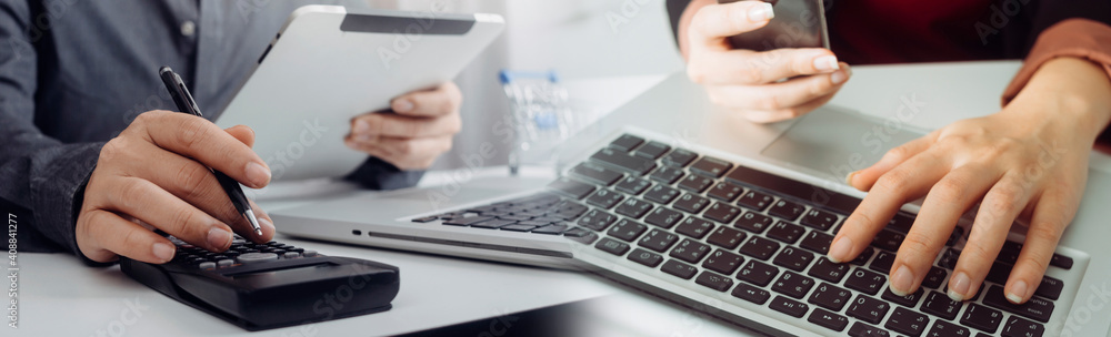 businesswoman hand using smart phone,mobile p payments online shopping,omni channel,digital tablet docking keyboard computer at office in sun light businesswoman hand using smart phone,mobile p payments online shopping,omni channel,digital tablet docking keyboard computer at office in sun light